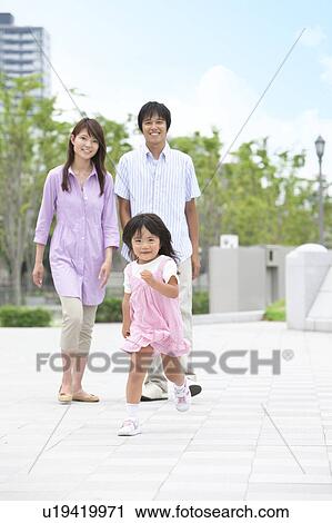 Young Girl Running, Parents Watching Behind View Large Photo Image Stock Image - Young Girl Running, Parents Watching Behind. Fotosearch