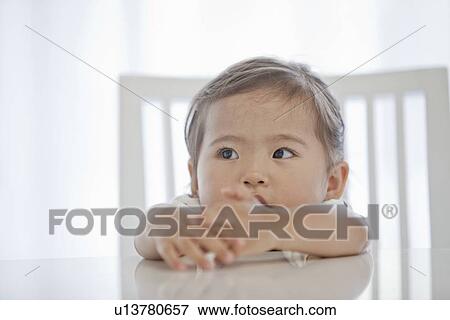 Young Girl Sitting at Table View Large Photo Image Stock Photo - Young Girl Sitting at Table. Fotosearch