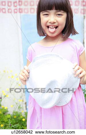 Stock Image - Young Girl Sticking Out Tongue. Fotosearch