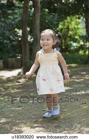 Stock Image - Young Girl Walking. Fotosearch