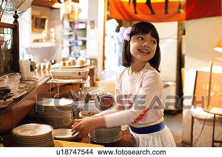 Picture - Young Girl Washing Dishes. Fotosearch
