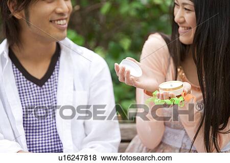 Young man proposing to girlfriend in a park View Large Photo Image Stock Photo - Young man proposing to girlfriend in a park. Fotosearch