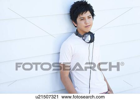 Stock Image - Young Man with Headphones. Fotosearch