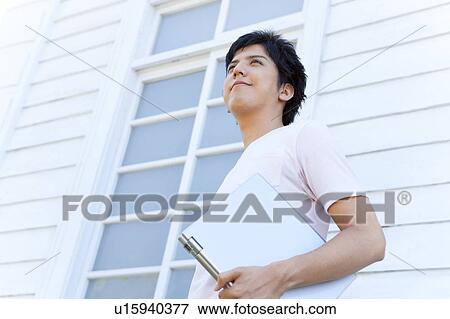 Young Man with Laptop View Large Photo Image Stock Photo - Young Man with Laptop. Fotosearch