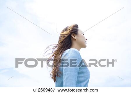 Young Woman Against Sky View Large Photo Image Stock Photo - Young Woman Against Sky. Fotosearch