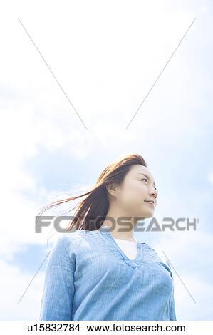 Picture - Young Woman Enjoying Herself Outdoors. Fotosearch