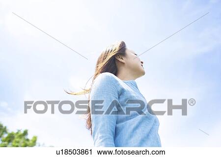 Young Woman Enjoying Herself Outdoors View Large Photo Image Stock Image - Young Woman Enjoying Herself Outdoors. Fotosearch