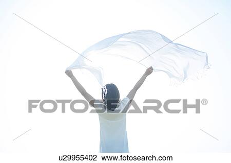 Young Woman Holding Up Scarf View Large Photo Image Stock Image - Young Woman Holding Up Scarf. Fotosearch