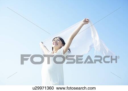 Young Woman Holding Up Scarf View Large Photo Image Stock Image - Young Woman Holding Up Scarf. Fotosearch