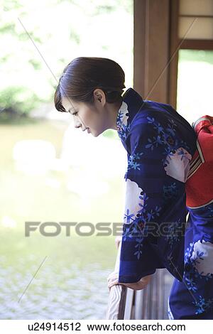 Young Woman in Kimono Looking Down From Balcony View Large Photo Image Stock Image - Young Woman in Kimono Looking Down From Balcony. Fotosearch