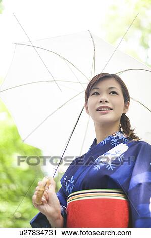 Young Woman in Yukata Holding Umbrella View Large Photo Image Stock Image - Young Woman in Yukata Holding Umbrella. Fotosearch