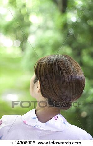 Stock Photograph - Young Woman in Yukata, Rear View. Fotosearch