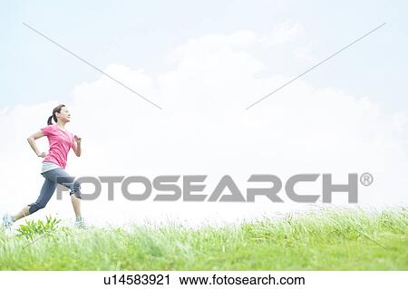 Stock Image - Young Woman Jogging. Fotosearch