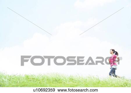 Young Woman Jogging View Large Photo Image Stock Photo - Young Woman Jogging. Fotosearch