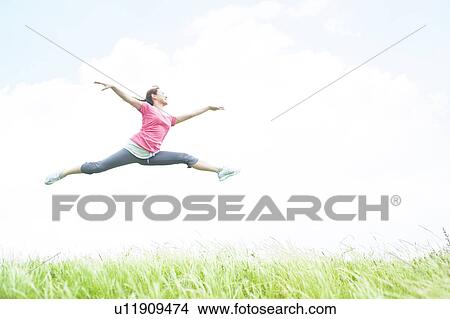 Picture - Young Woman Jumping. Fotosearch