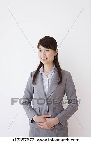 Stock Image - Young woman looking away. Fotosearch