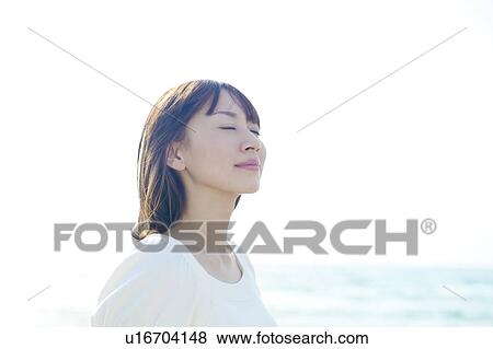 Stock Photo - Young Woman on Beach. Fotosearch