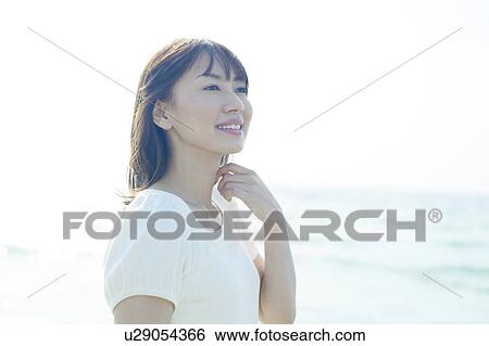 Stock Photograph - Young Woman on Beach. Fotosearch