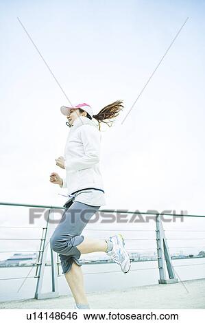 Stock Photograph - Young Woman Running. Fotosearch