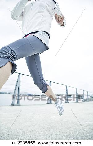 Stock Photography - Young Woman Running. Fotosearch