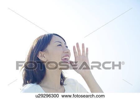 Stock Image - Young Woman Shouting. Fotosearch