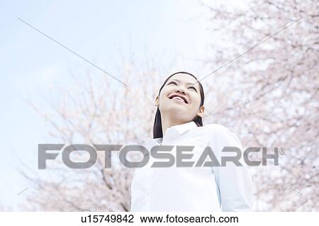 Young woman standing View Large Photo Image Stock Image - Young woman standing. Fotosearch
