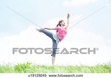 Young Woman Stretching on Grass View Large Photo Image Stock Photography - Young Woman Stretching on Grass. Fotosearch