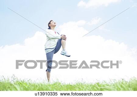 Stock Photography - Young Woman Stretching. Fotosearch
