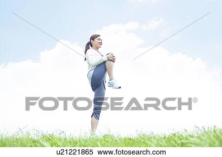 Stock Photography - Young Woman Stretching. Fotosearch