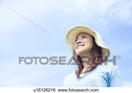 Stock Photograph - Young Woman Wearing Hat. Fotosearch