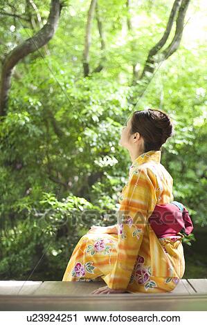 Young Woman Wearing Yukata and Looking at Garden View Large Photo Image Stock Image - Young Woman Wearing Yukata and Looking at Garden. Fotosearch