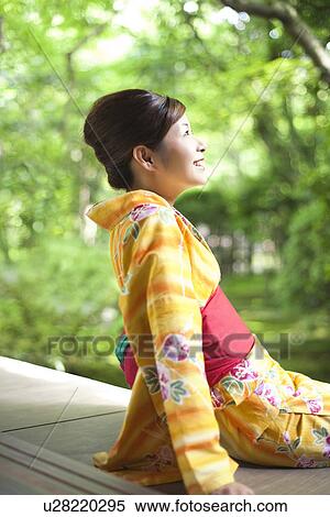 Young Woman Wearing Yukata and Looking at Garden View Large Photo Image Stock Photography - Young Woman Wearing Yukata and Looking at Garden. Fotosearch
