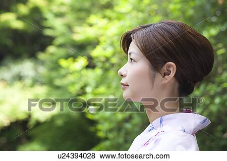 Young Woman Wearing Yukata in Garden View Large Photo Image Stock Photo - Young Woman Wearing Yukata in Garden. Fotosearch