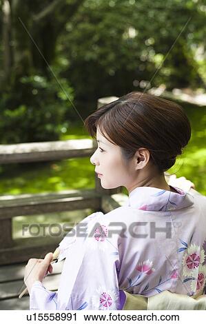 Stock Image - Young Woman Wearing Yukata. Fotosearch
