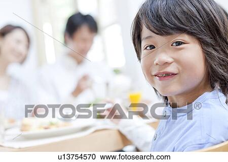 A boy having a meal View Large Photo Image Stock Image - A boy having a meal. Fotosearch