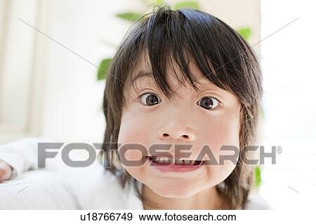 A boy making a funny face View Large Photo Image Stock Photo - A boy making a funny face. Fotosearch