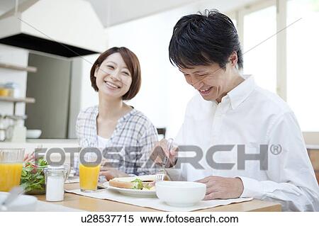 A couple having a meal View Large Photo Image Stock Photography - A couple having a meal. Fotosearch