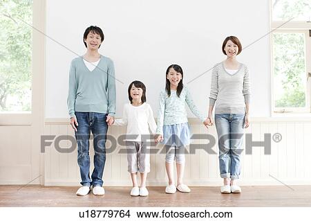 Picture - A family holding hands. Fotosearch