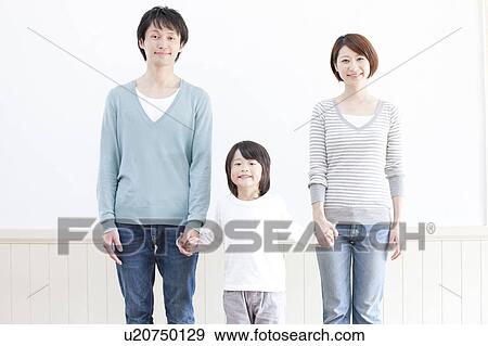 A family holding hands View Large Photo Image Stock Photo - A family holding hands. Fotosearch