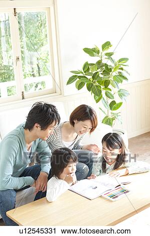 Stock Image - A family in the living room. Fotosearch