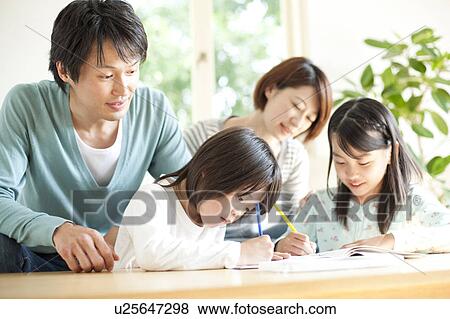 Stock Photo - A family in the living room. Fotosearch