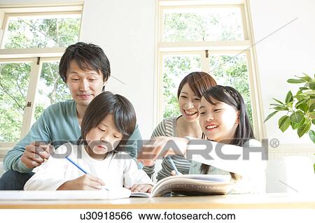 A family in the living room View Large Photo Image Stock Photograph - A family in the living room. Fotosearch
