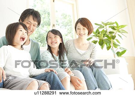 A family smiling View Large Photo Image Stock Image - A family smiling. Fotosearch