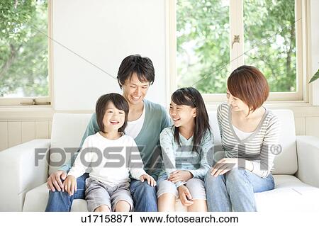 A family smiling View Large Photo Image Stock Image - A family smiling. Fotosearch