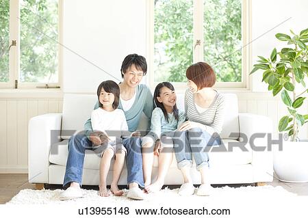 Stock Photo - A family smiling. Fotosearch