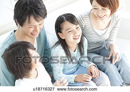 Stock Photo - A family smiling. Fotosearch
