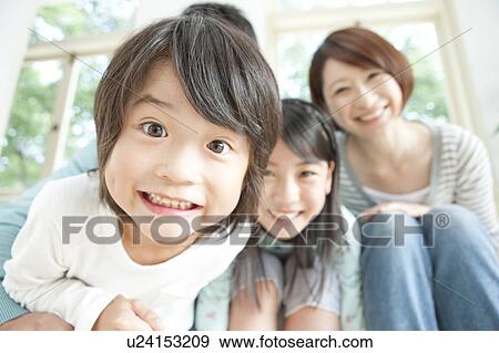 A family smiling View Large Photo Image Stock Photo - A family smiling. Fotosearch
