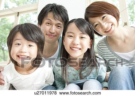 A family smiling View Large Photo Image Stock Photo - A family smiling. Fotosearch