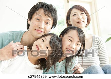 A family smiling View Large Photo Image Stock Photo - A family smiling. Fotosearch