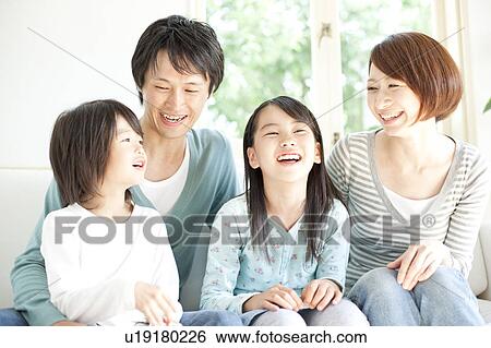 A family smiling View Large Photo Image Stock Photograph - A family smiling. Fotosearch